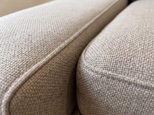 Detalle de la tela y las costuras de un sillón tapizado